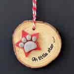 Christmas Paw Print on Star hanging Wood Slice